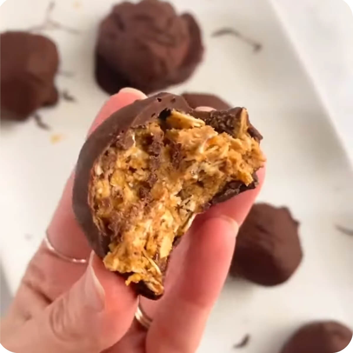 Bite sized serving of protein oatmeal covered in hard chocolate shell