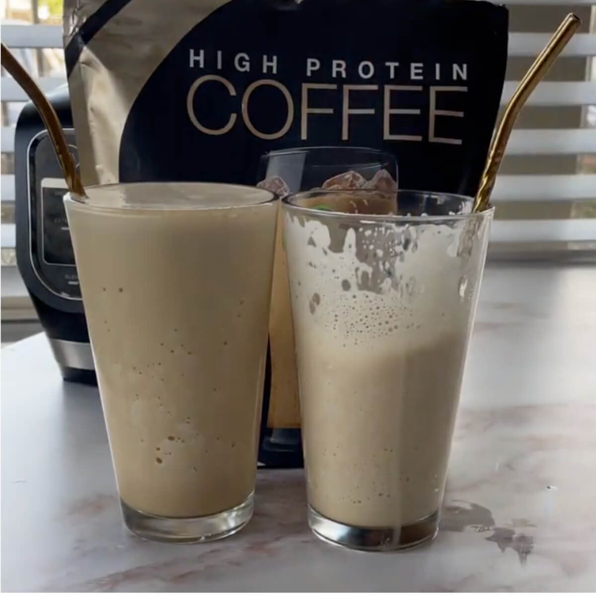 Two protein vanilla milkshakes in glass cups