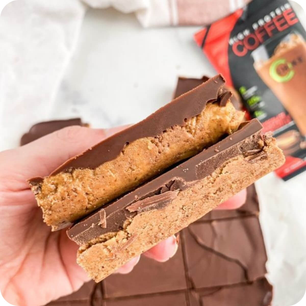 Protein peanut butter bar with a layer of solid chocolate on top